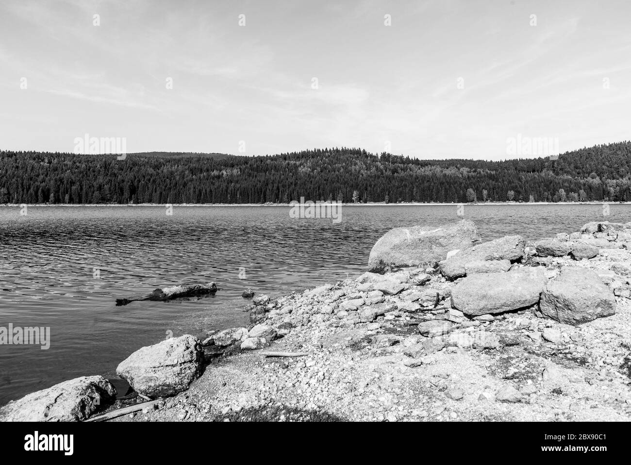 Mountain water reservoir Josefuv Dul, aka Josefodolska Dam, Jizera Mountains, Czech Republic. Sunny summer day. Black and white image. Stock Photo