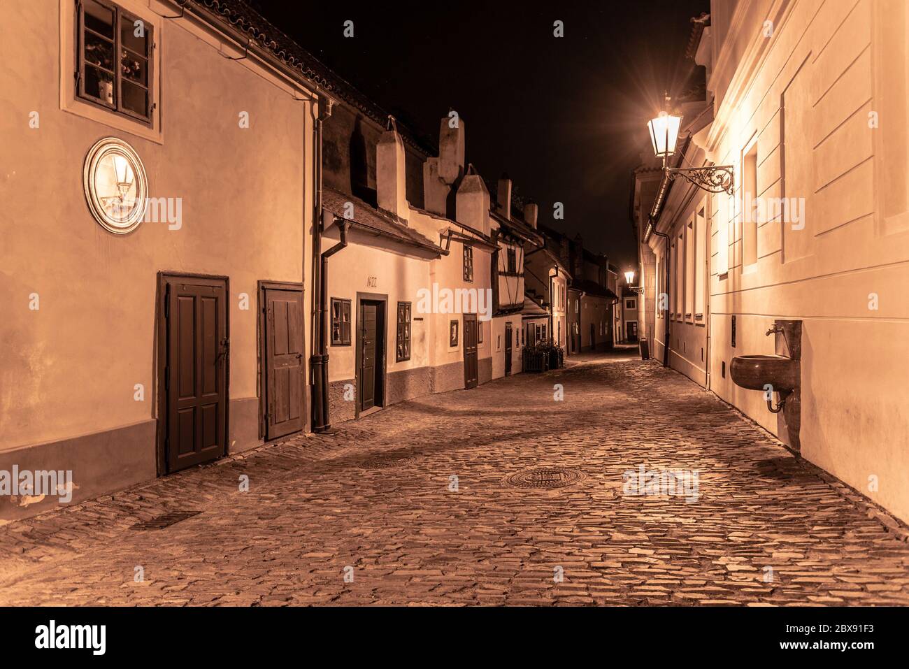 Small medieval houses in Golden Lane by night, Prague Castle, Czech