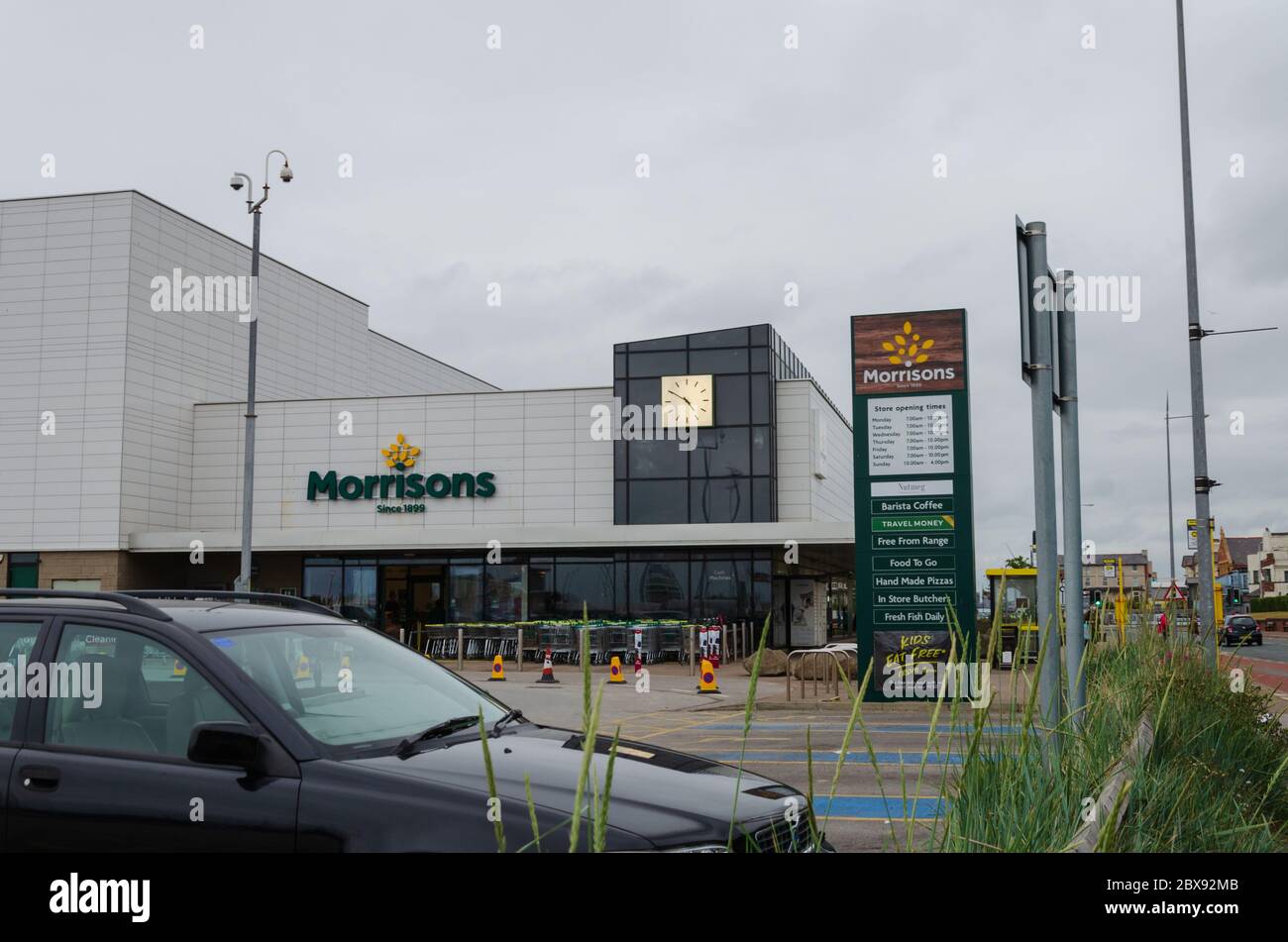 New Brighton, UK: Jun 3, 2020: The drop off and collection point at the front of Morrisons supermarket has been closed and coned off to help with soci Stock Photo