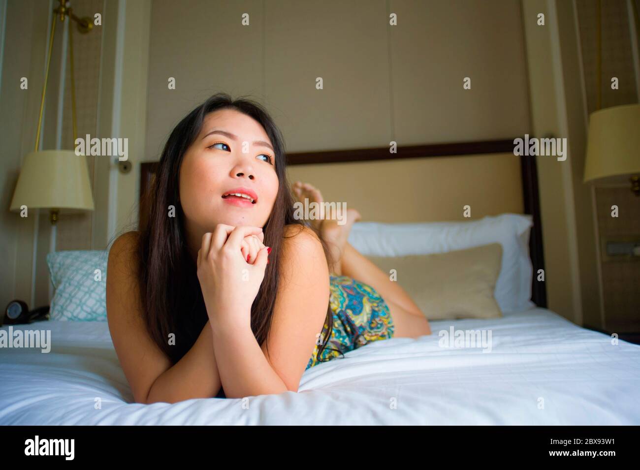 lifestyle indoors portrait of young beautiful and happy Asian Korean