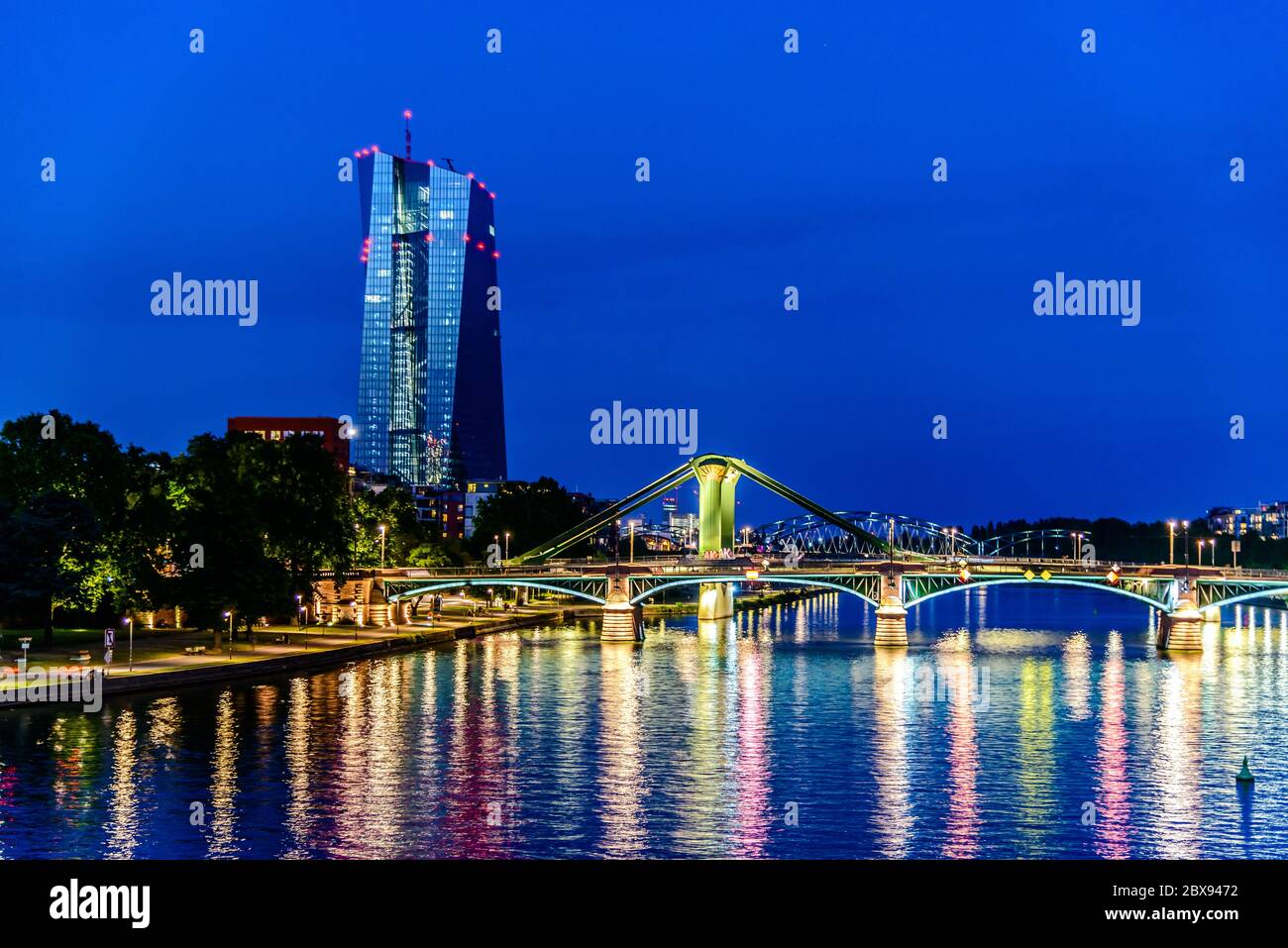 Beautiful view on  Frankfurt am Main (european finance center city), downtown skyline cityscape with EZB central bank, bridge during twilight blue hou Stock Photo