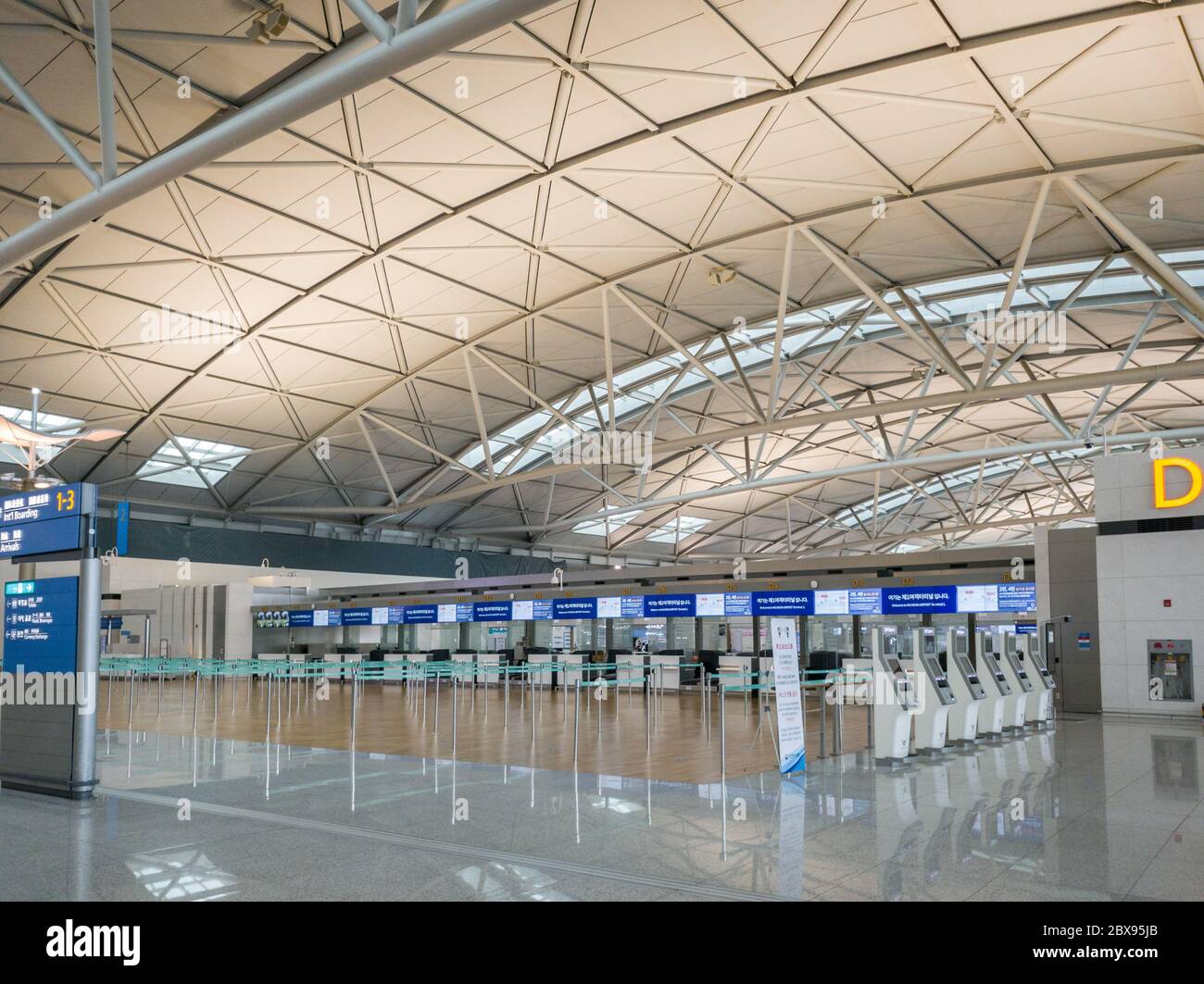 Incheon, South Korea - Empty check-in counter at Seoul Incheon International Airport in Coronavirus pandemic outbreak. COVID-19 hits airline indsutry. Stock Photo