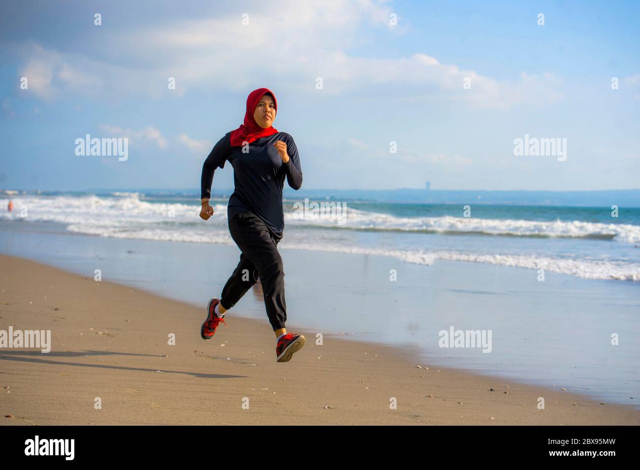 young healthy and active runner Muslim woman in Islam hijab head scarf