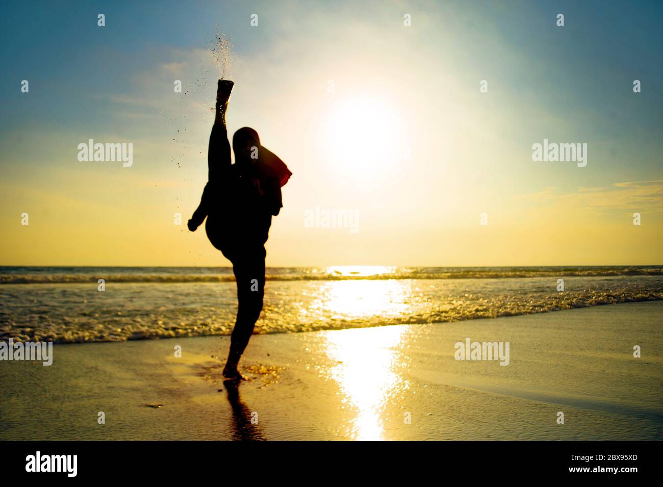 silhouette of young fit and aggressive Muslim woman covered in Islam