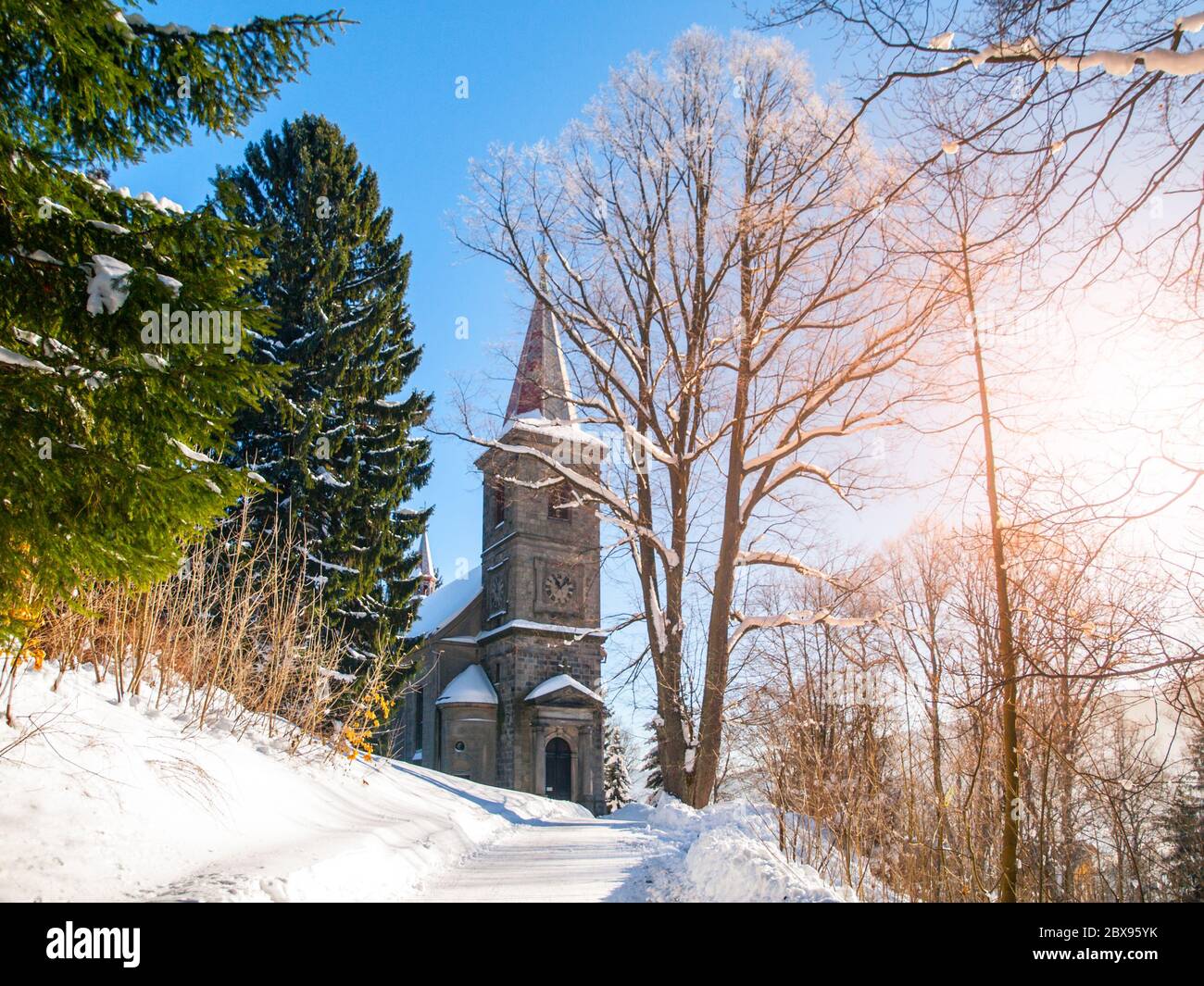 Stone church of Saint Peter and Paul in Tanvald on sunny winter day, Czech Republic. Stock Photo