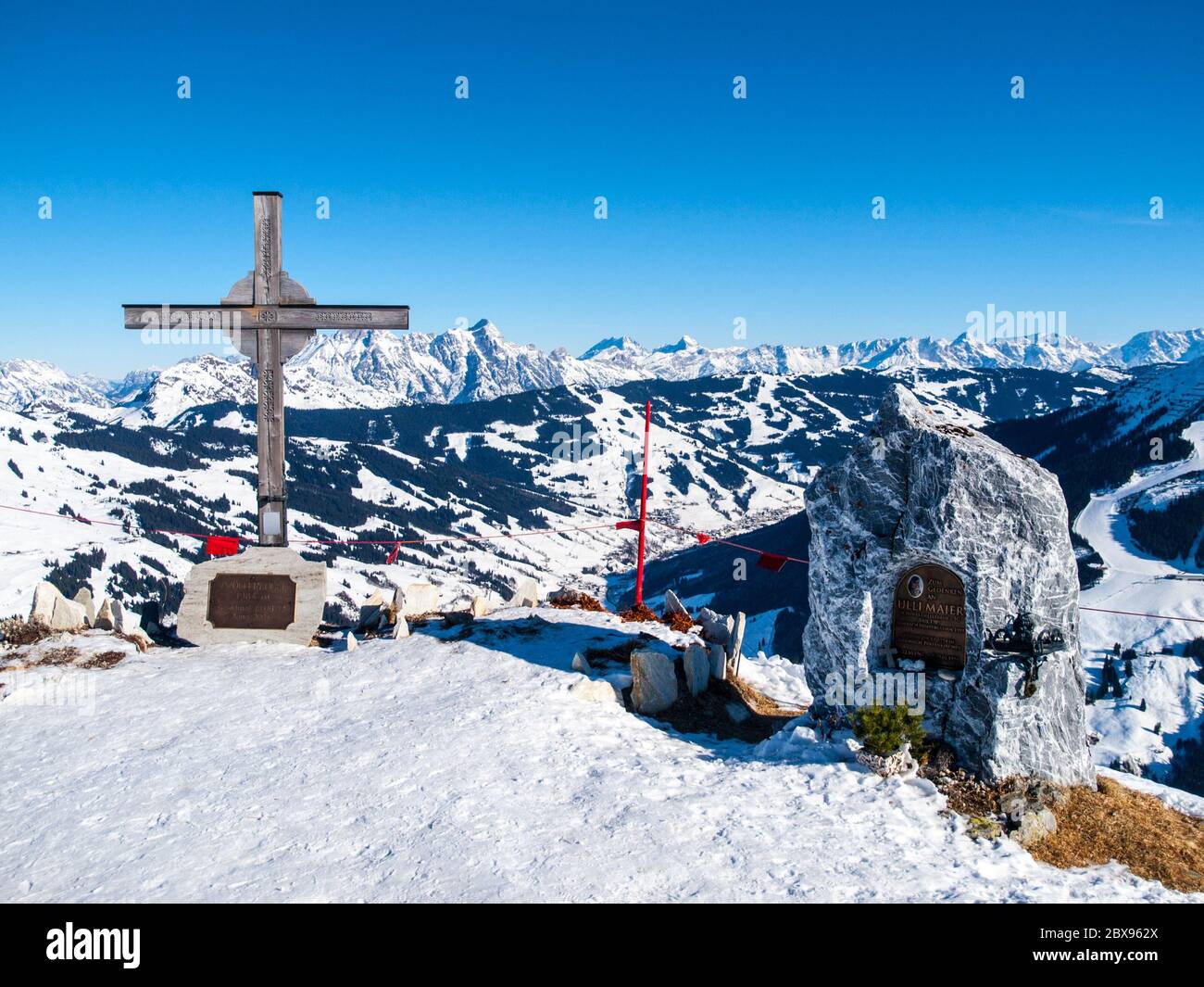Summit cross on Zwolferkogel. Alpine winter ski resort Saalbach Hinterglemm, Austrian Alps. Stock Photo
