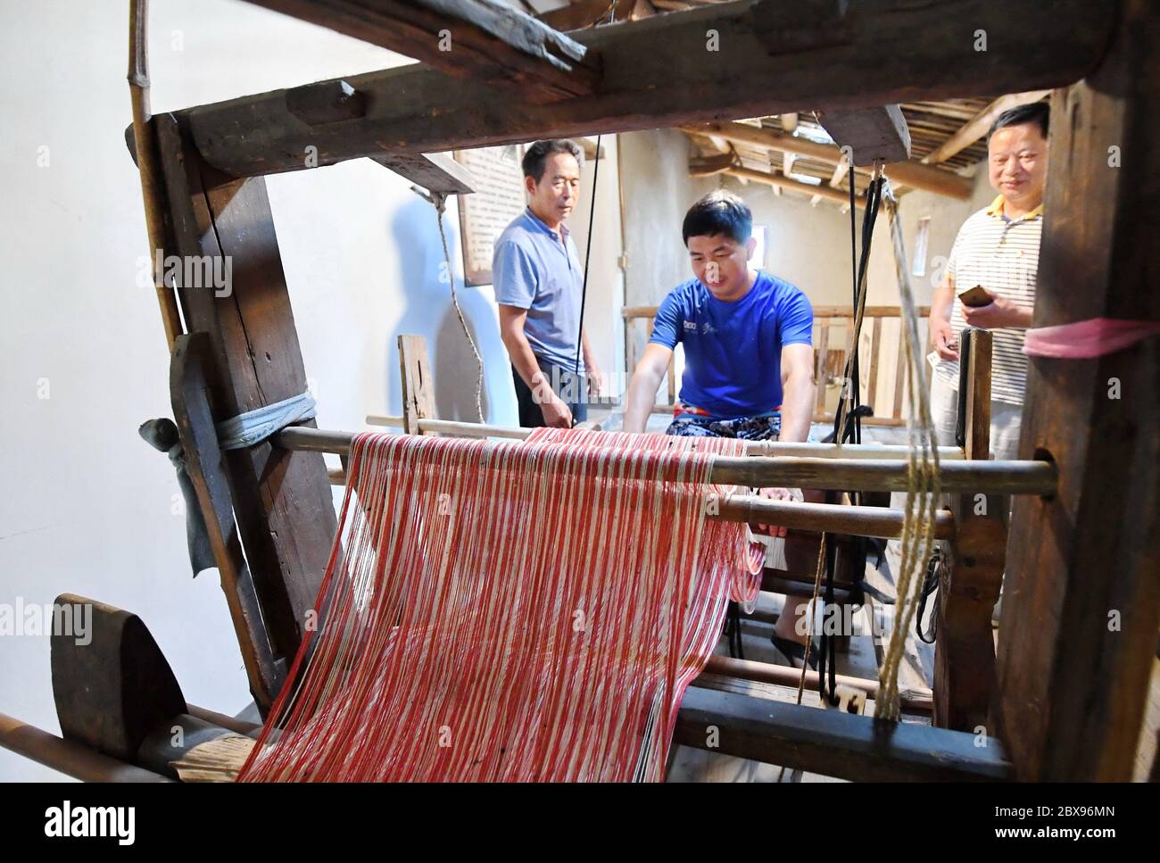 Yongchun Fujian 6th June A Tourist Experiences A Traditional Loom At A Museum In Waibi