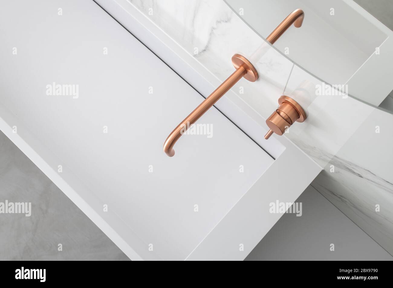 Elegant Rectangle White Bathroom Vessel Sink with Copper Color Faucet Stock Photo