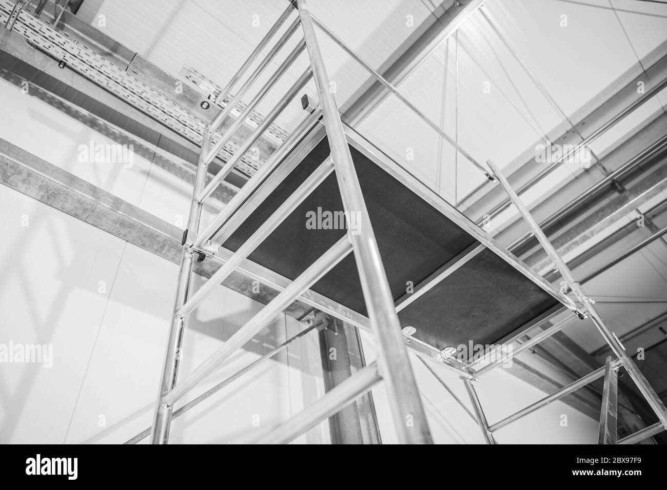 Industrial Equipment. New Aluminium Scaffolding Assembled Inside Commercial Warehouse Building. Stock Photo