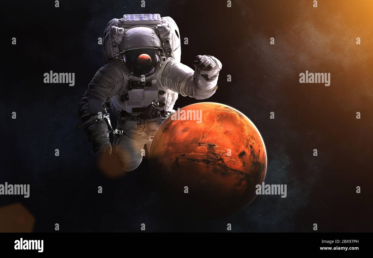 Giant astronaut and Mars. Solar system Stock Photo