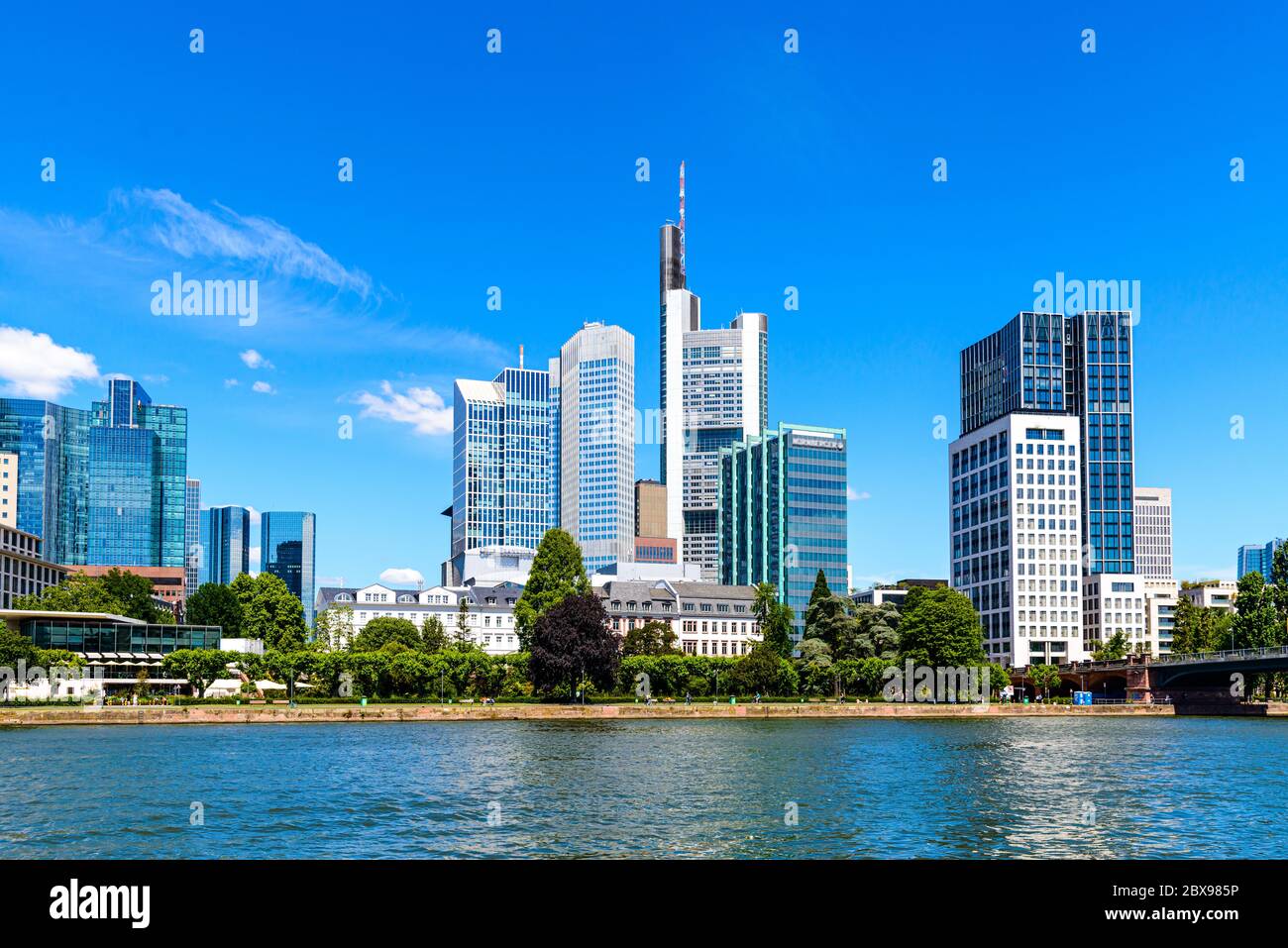 Beautiful view on  Frankfurt am Main skyline cityscape with blue sky, clouds, Main river in spring. Hessen, Hesse, Germany. Stock Photo