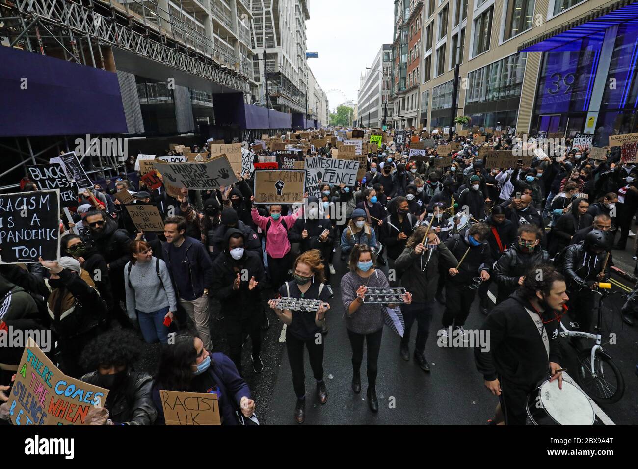 People take part in a Black Lives Matter protest rally march from ...
