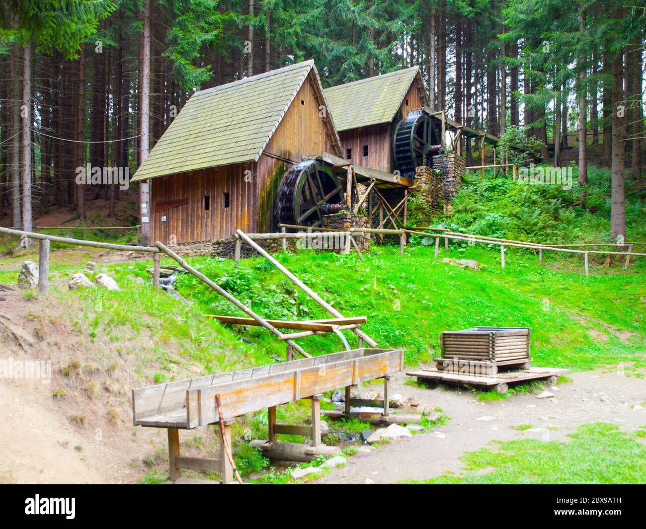 Gold ore mills. Medieval wooden water mills in Zlate Hory, Czech Republic. Stock Photo