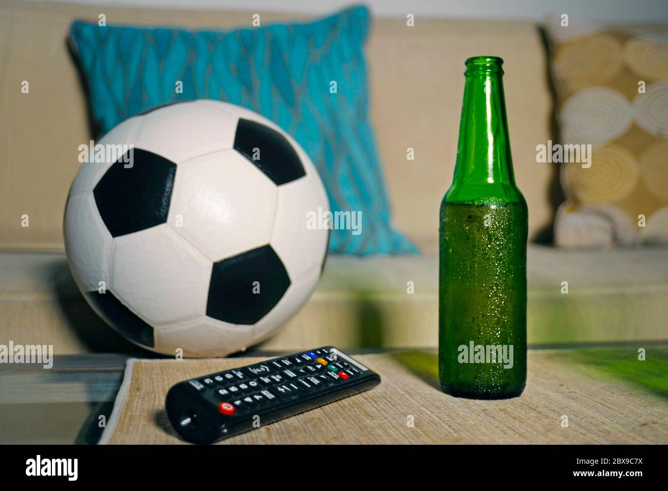 Conceptual Still Life No People About Watching Football Game In Television With Friends Featuring Soccer Ball And Remote Control Tv On Living Room Sof Stock Photo Alamy