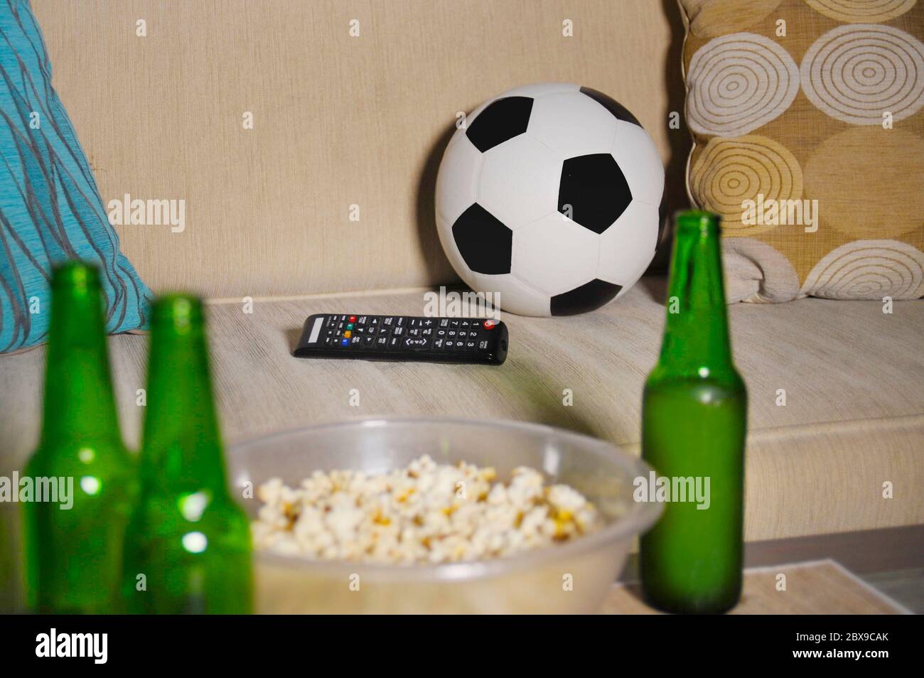 Conceptual Still Life No People About Watching Football Game In Television With Friends Featuring Soccer Ball And Remote Control Tv On Living Room Sof Stock Photo Alamy