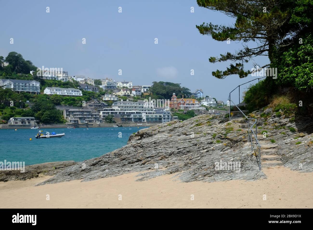 Mill Bay Beach at East Portlemouth, looking towards Salcombe town and estuary on a bright summer's day. Stock Photo