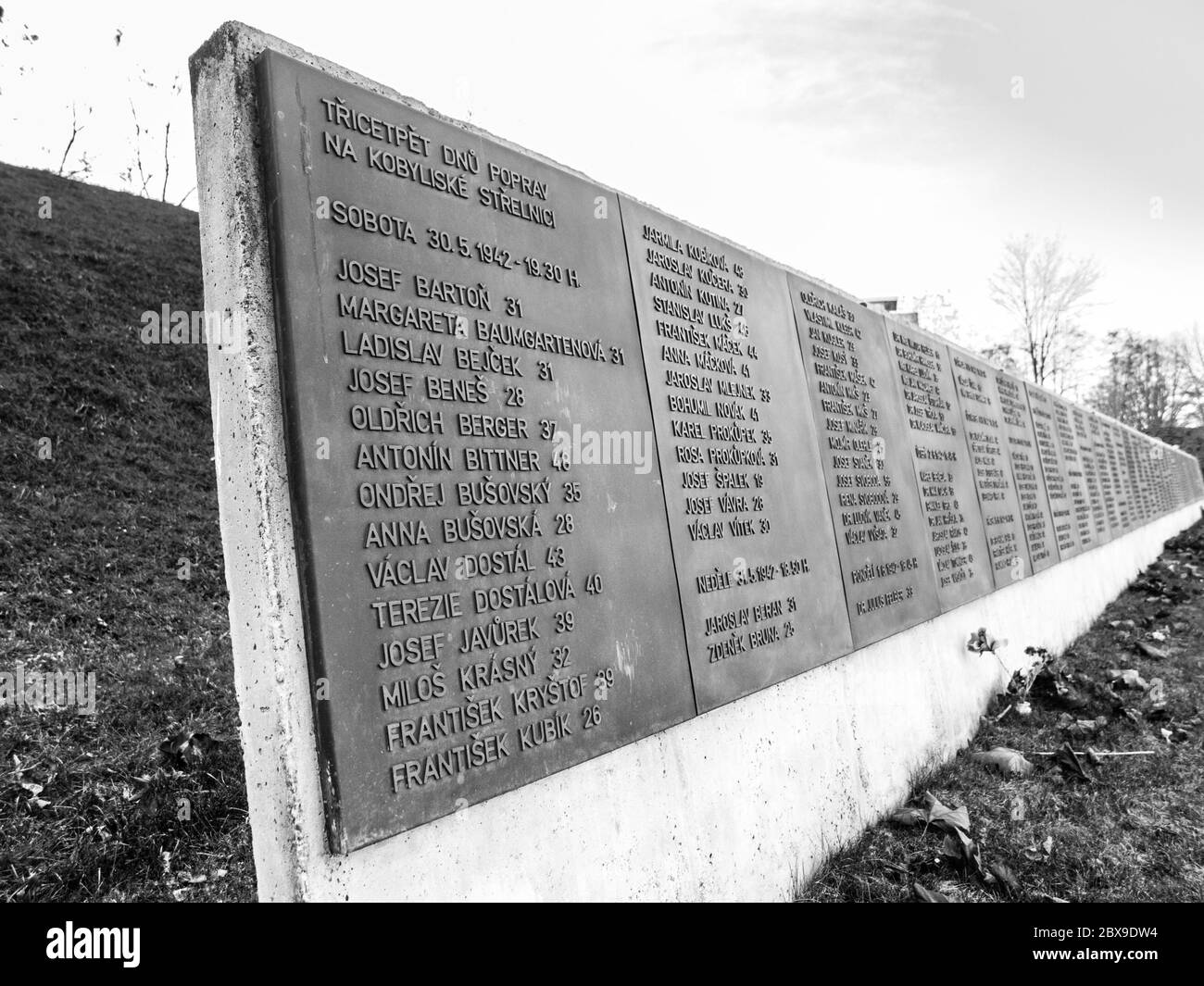 PRAGUE, CZECH REPUBLIC - DECEMBER 9, 2017: List of victims in former Kobylisy Shooting Range, Prague, Czech Republic. Place of mass executions during WWII by Nazis after the assassination of Reinhard Heydrich. Black and white image. Stock Photo