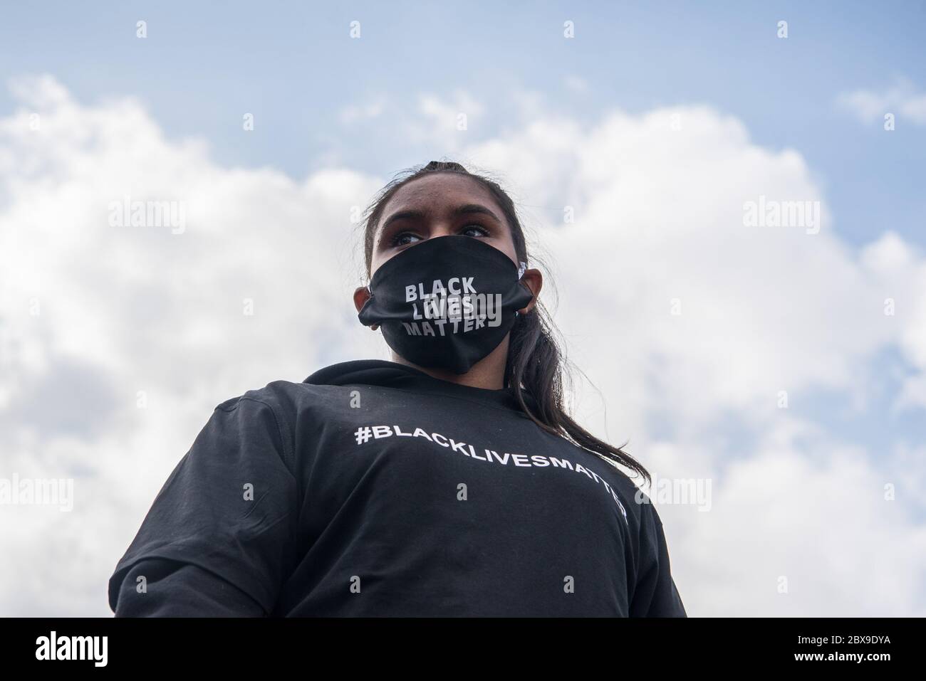Adelaide, Australia. 06th June, 2020. A protester looks on while wearing a 'Black Lives Matter' face mask during the demonstration. Thousands of protesters gathered at Adelaide's Victoria Square demonstrating in support of the Black Lives Matter movement and against Aboriginal Australian deaths in custody. Sparked by the death of African American George Floyd at the hands of a white police officer in the US state of Minneapolis, protests were observed in all major Australian cities. Credit: SOPA Images Limited/Alamy Live News Stock Photo