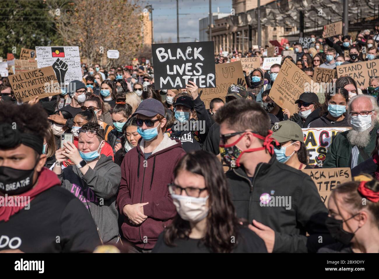 Adelaide, Australia. 06th June, 2020. Protesters hold placards while wearing face masks during the demonstration. Thousands of protesters gathered at Adelaide's Victoria Square demonstrating in support of the Black Lives Matter movement and against Aboriginal Australian deaths in custody. Sparked by the death of African American George Floyd at the hands of a white police officer in the US state of Minneapolis, protests were observed in all major Australian cities. Credit: SOPA Images Limited/Alamy Live News Stock Photo