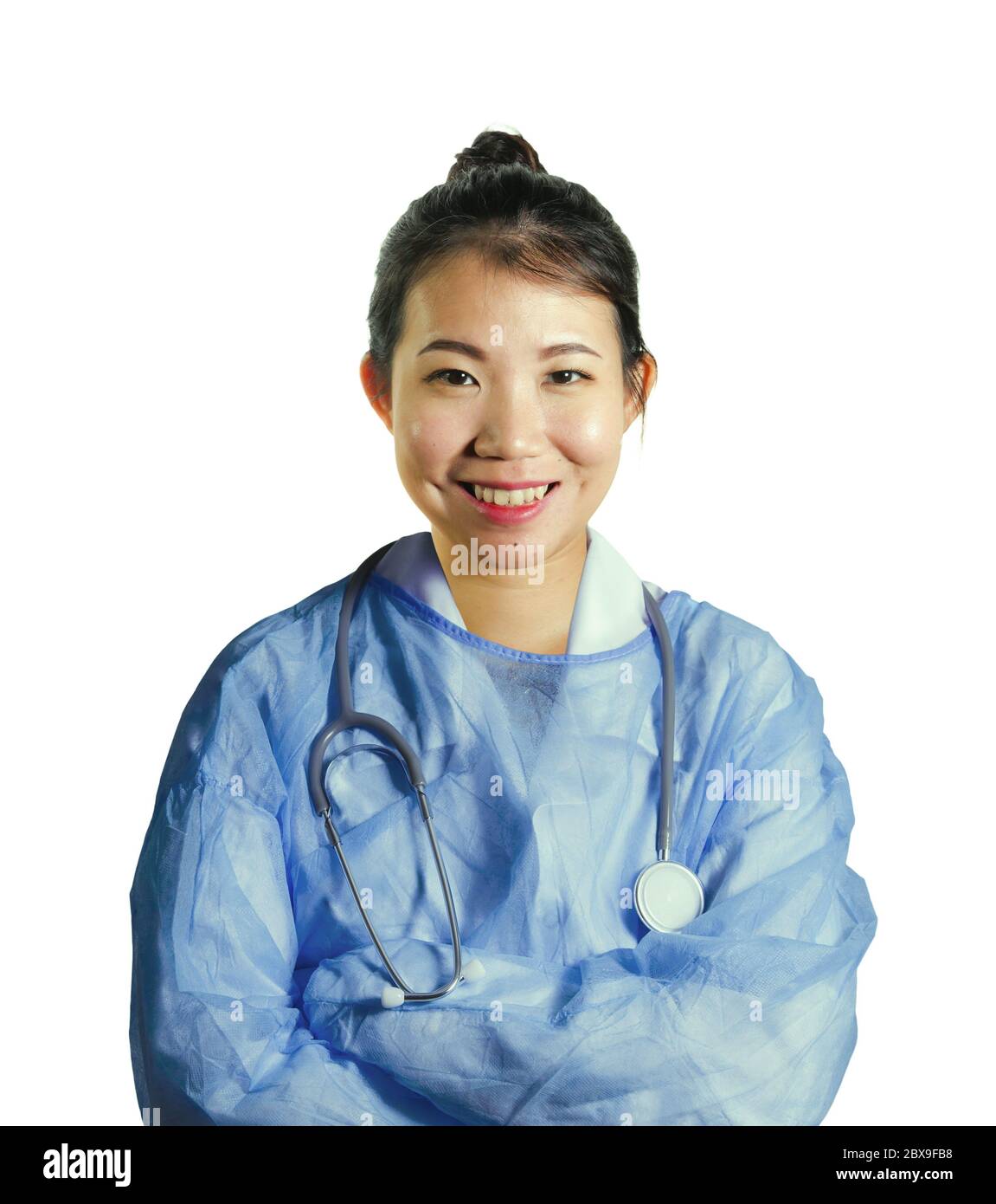 young happy and attractive Asian Korean medicine doctor woman in blue scrubs smiling cheerful posing for hospital corporate staff portrait in health c Stock Photo