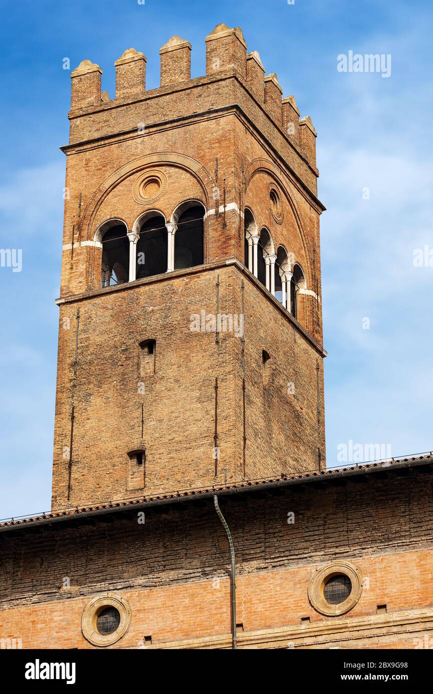 Closeup of the medieval Arengo Tower (1259) over the Palazzo del Podesta (1200 - XV century), Piazza Maggiore, Bologna downtown, Emilia-Romagna, Italy Stock Photo