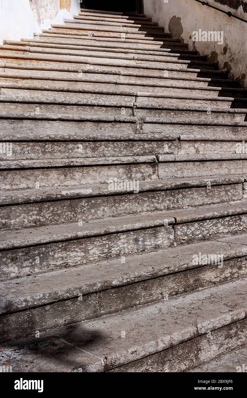 Closeup of a staircase with old stone steps - Background. Trentino Alto ...