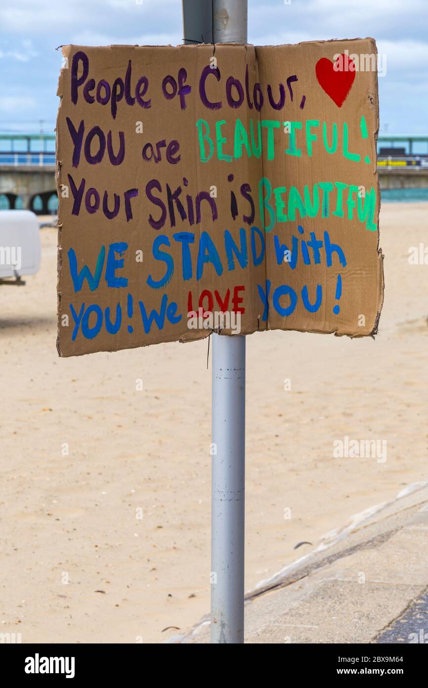 People of colour you are beautiful your skin is beautiful we stand with you we love you sign for Black Lives Matter anti racism protest at Bournemouth Stock Photo