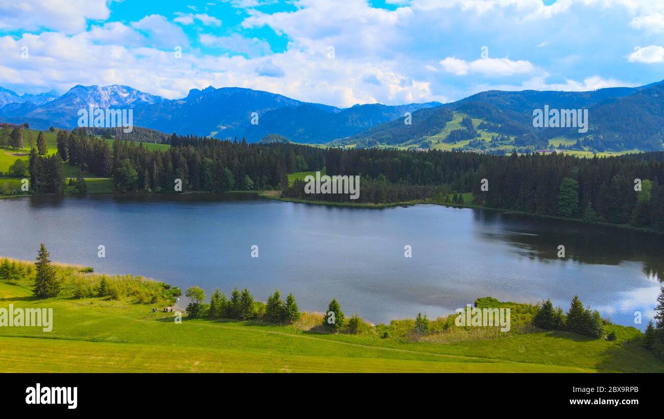 Flight over the beautiful rural landscape of Bavaria Allgau in the ...