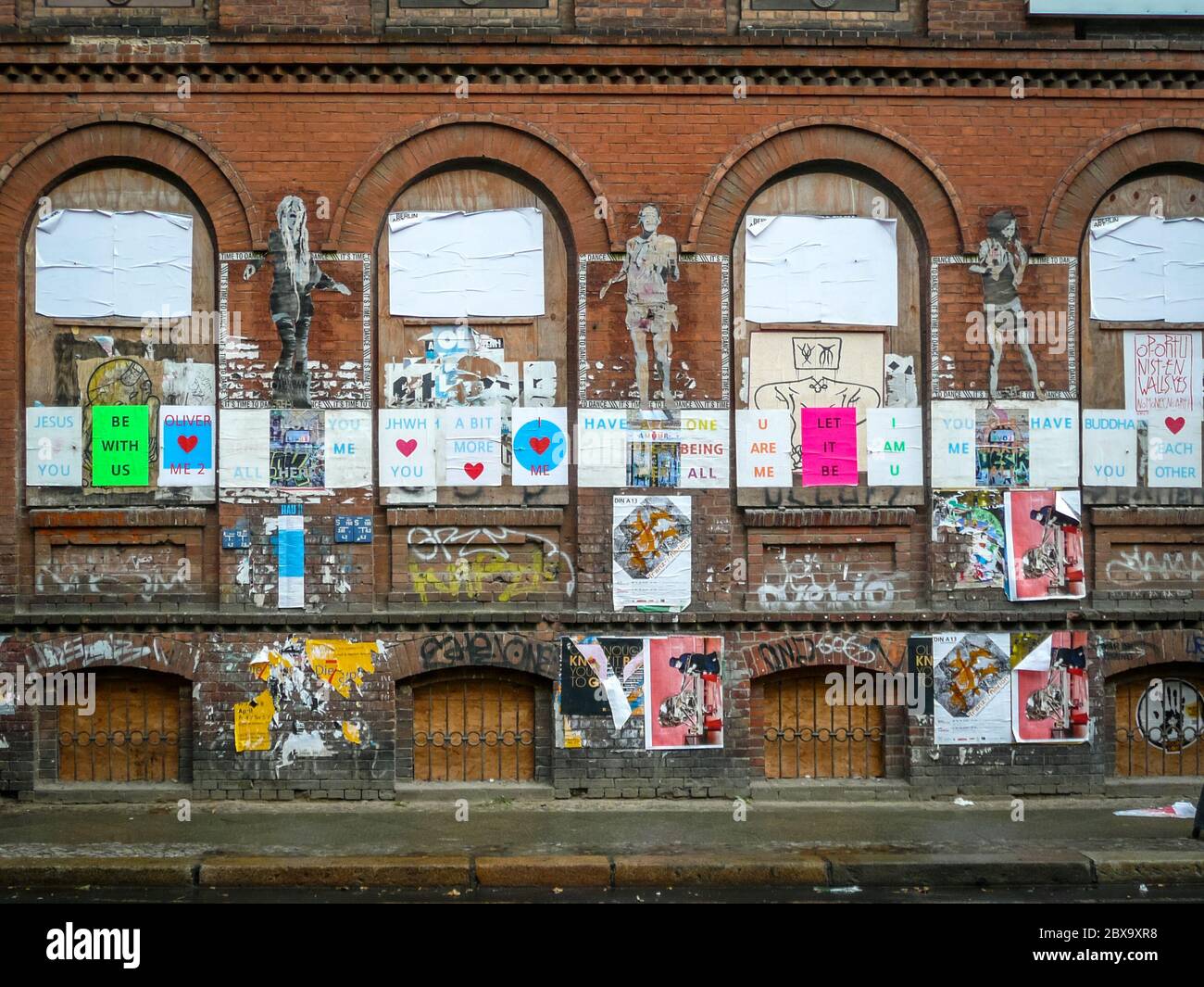 Berlin/Germany - April 21, 2014 : Street art and posters on historic building Stock Photo