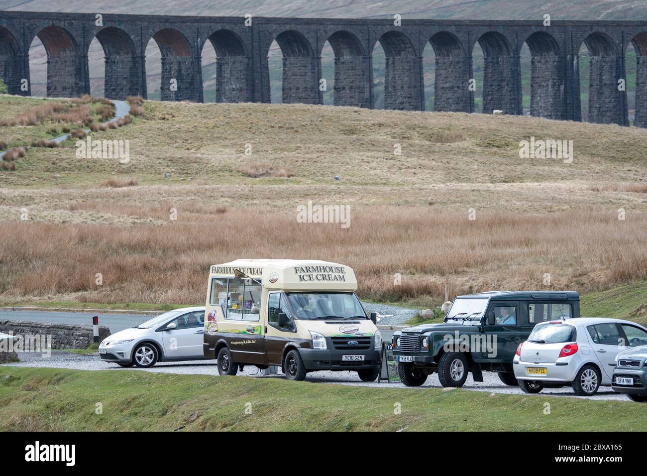 Ribblehead Viaduct, North Yorkshire, UK13th May 2020. Visitors free from travel restrictions visit Ribblehead in the Yorkshire Dales, where an Ice Cre Stock Photo