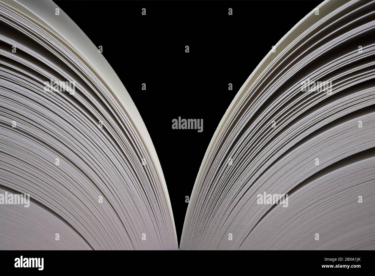 Open book with open pages on both sides. Isolated on black Stock Photo
