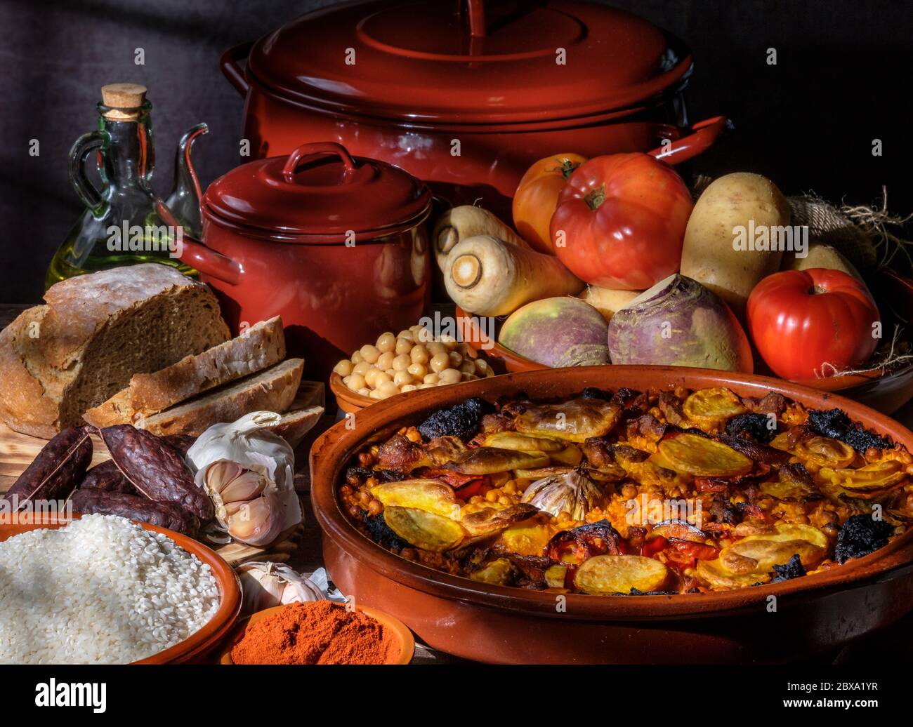 Valencian baked rice at oven with pork, blood sausage garlic tomato