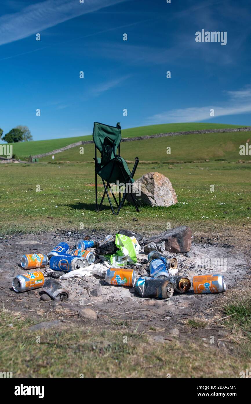 Rubbish left after a BBQ in a rural beauty spot on the banks of the River Eden, Mallerstang, near Kirkby Stephen, Cumbria, UK. Stock Photo