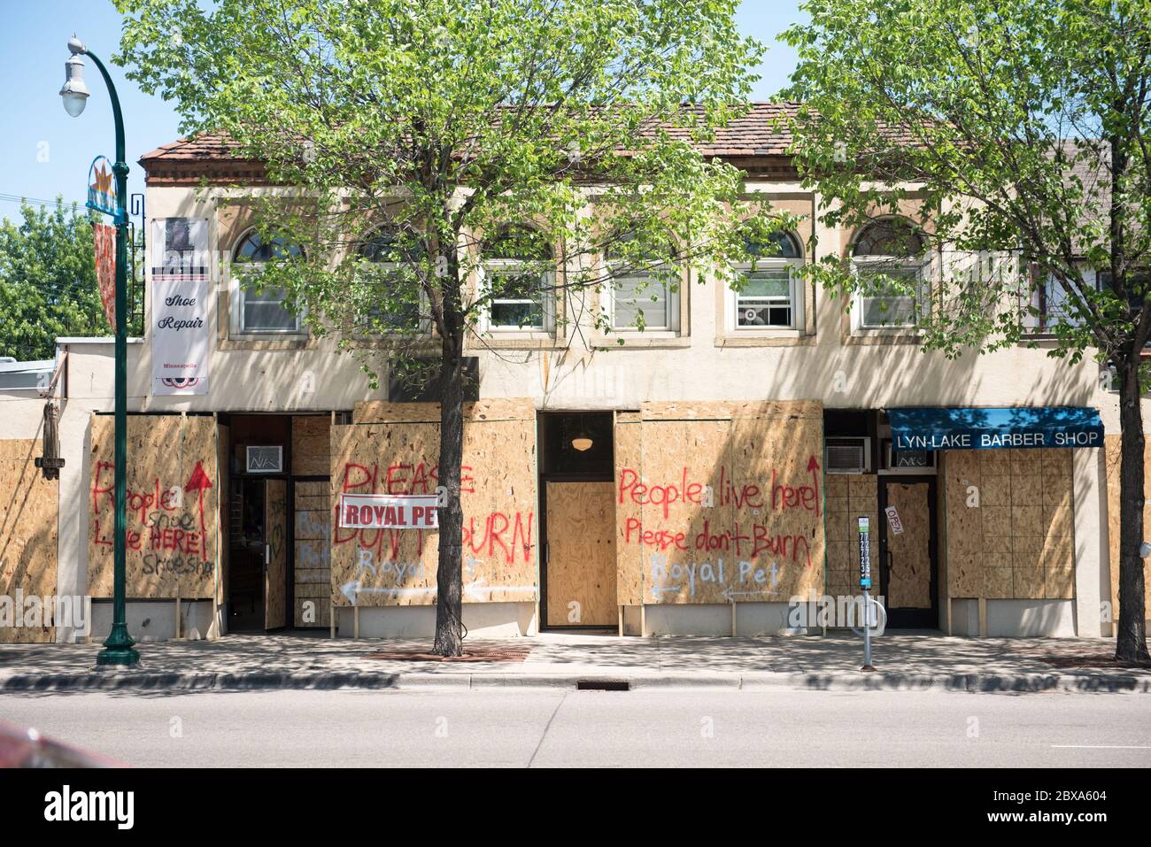 Local storefronts and apartments on East Lake Street, painted to deflect arsonists in the aftermath of George Floyd's murder nearby. Stock Photo