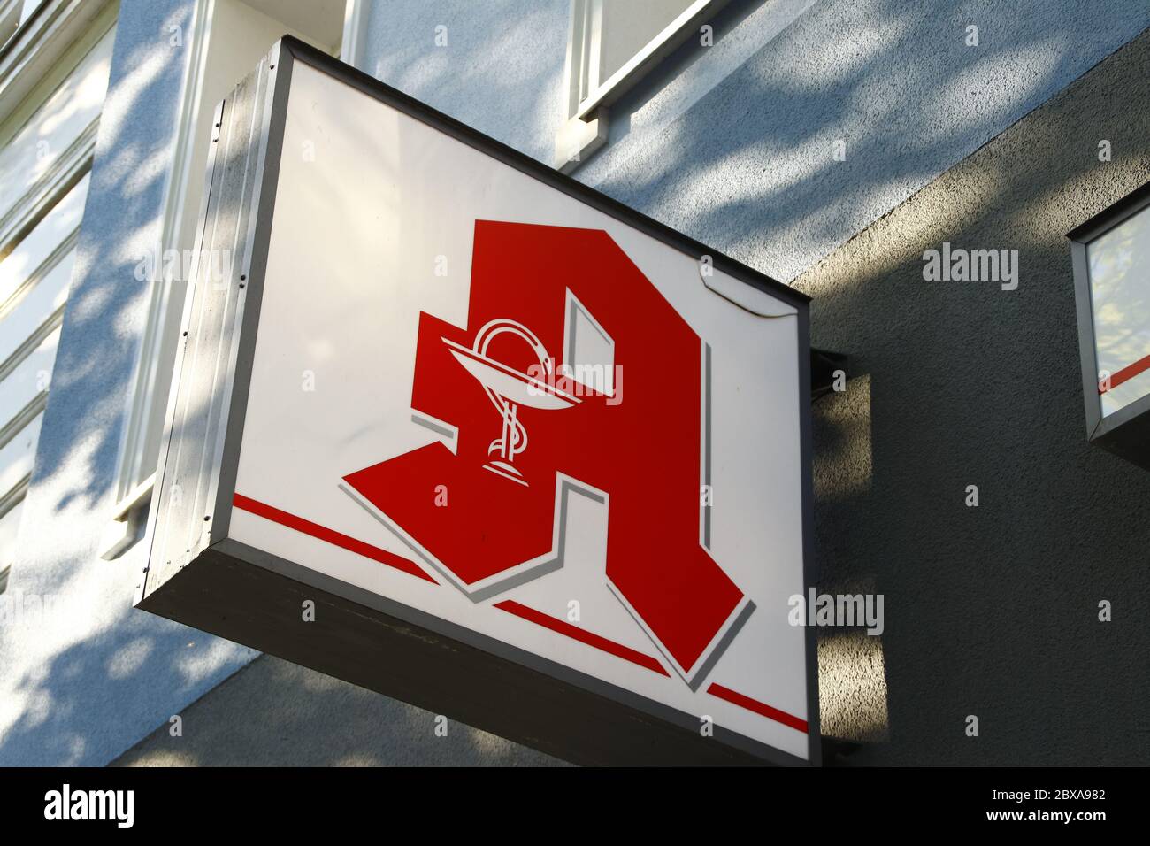 Berlin / Germany - April 22, 2020: Close up of an Apotheke sign (meaning pharmacy / apothecary). Bold, red A on white background. Stock Photo