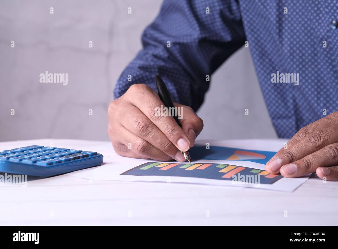 businessman analyzing financial data at office desk  Stock Photo