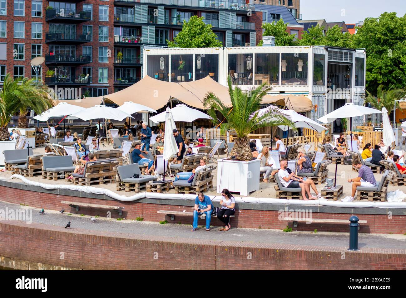 Temporary pop-up city beach club restaurant. Terrace with enough of space between tables following the rules of social distancing during coronavirus Stock Photo