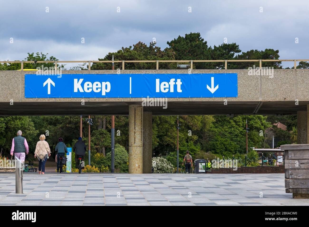 Keep left signs at Pier approach to keep people segregated and going one way as Coronavirus restrictions are eased at Bournemouth, Dorset UK in June Stock Photo