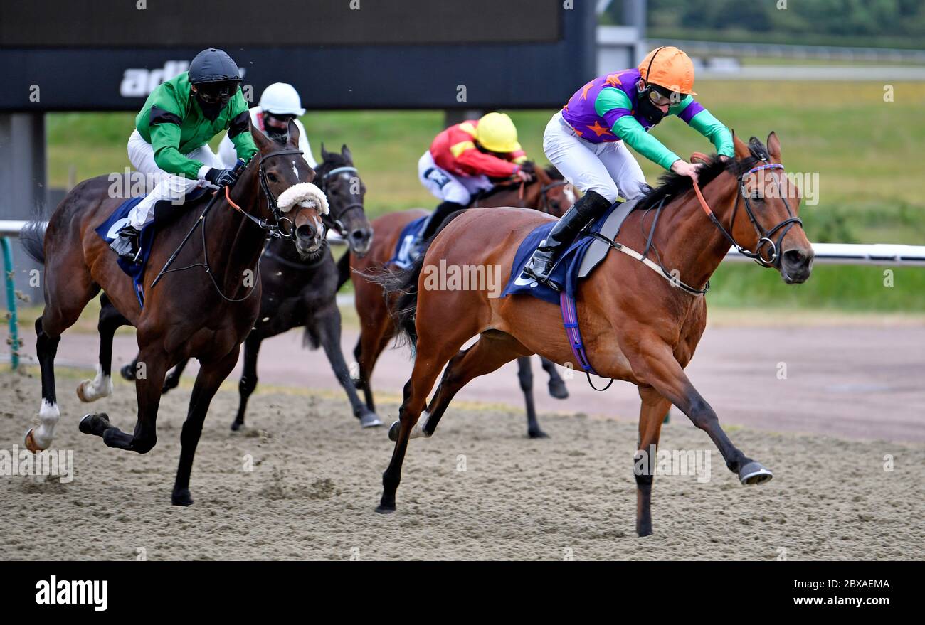 Lady Bowthorpe ridden by Thomas Greatrex on their way to winning the Heed Your Hunch At Betway Handicap at Lingfield Racecourse. Stock Photo