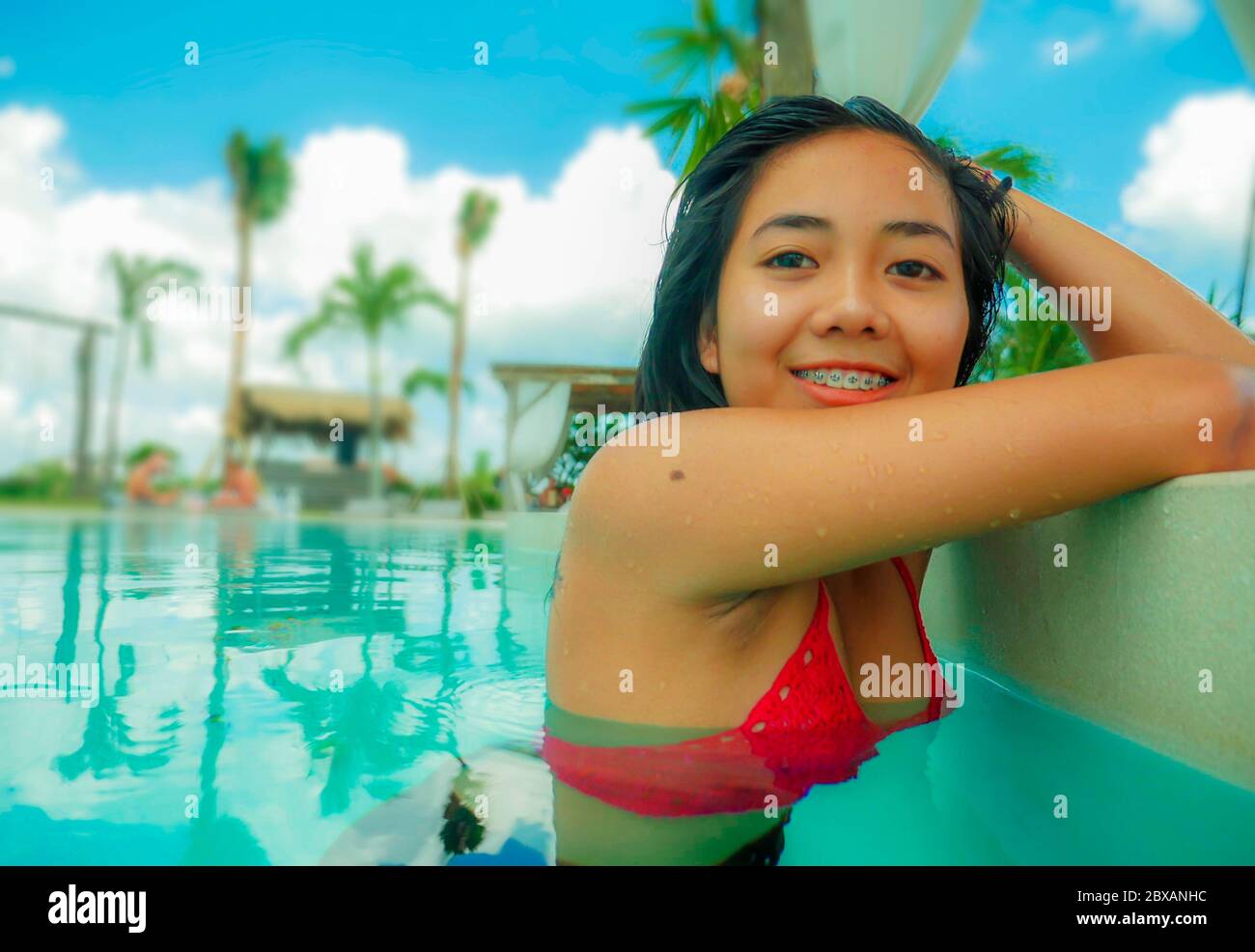 outdoors portrait of young beautiful and sweet Asian Indonesian teenager gi...