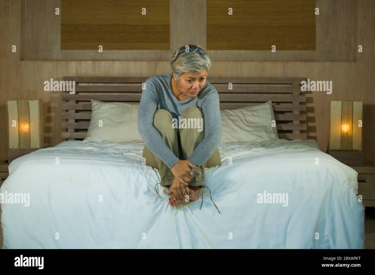 Asian woman crying in bed hi-res stock photography and images - Alamy