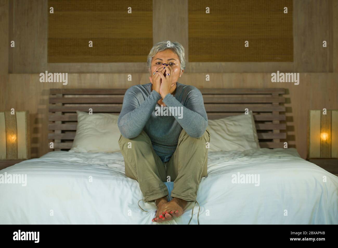 Asian woman crying in bed hi-res stock photography and images - Alamy