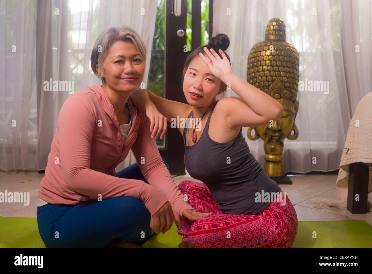 Happy Girlfriends Enjoying Yoga And Fitness Workout At Home Two