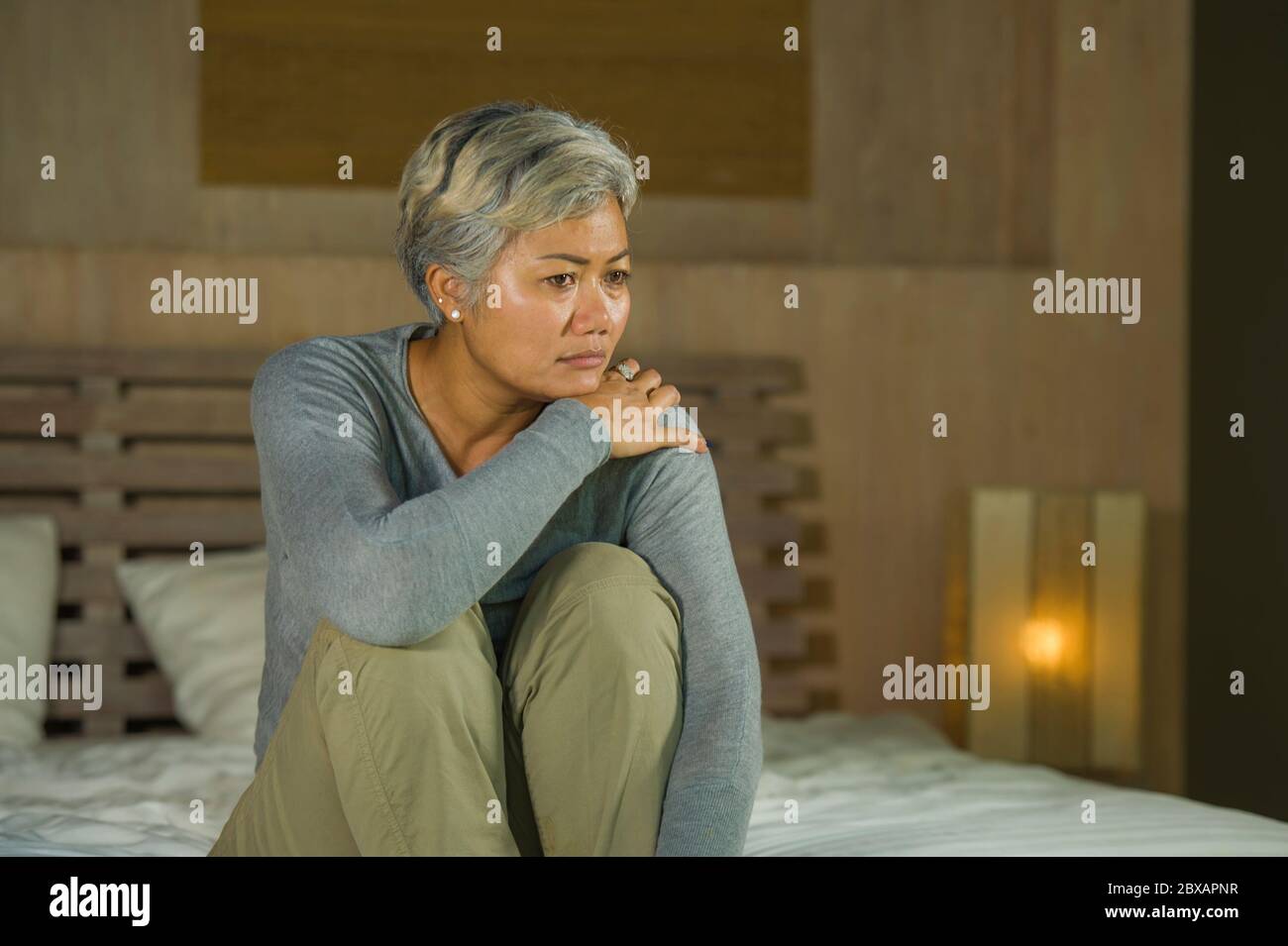 Asian woman crying in bed hi-res stock photography and images - Alamy