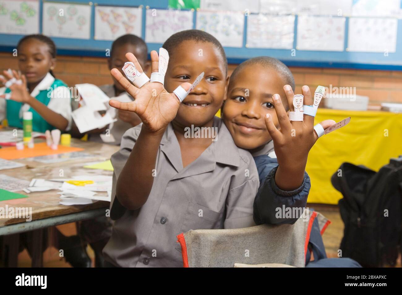 Boys making finger puppets Stock Photo Alamy
