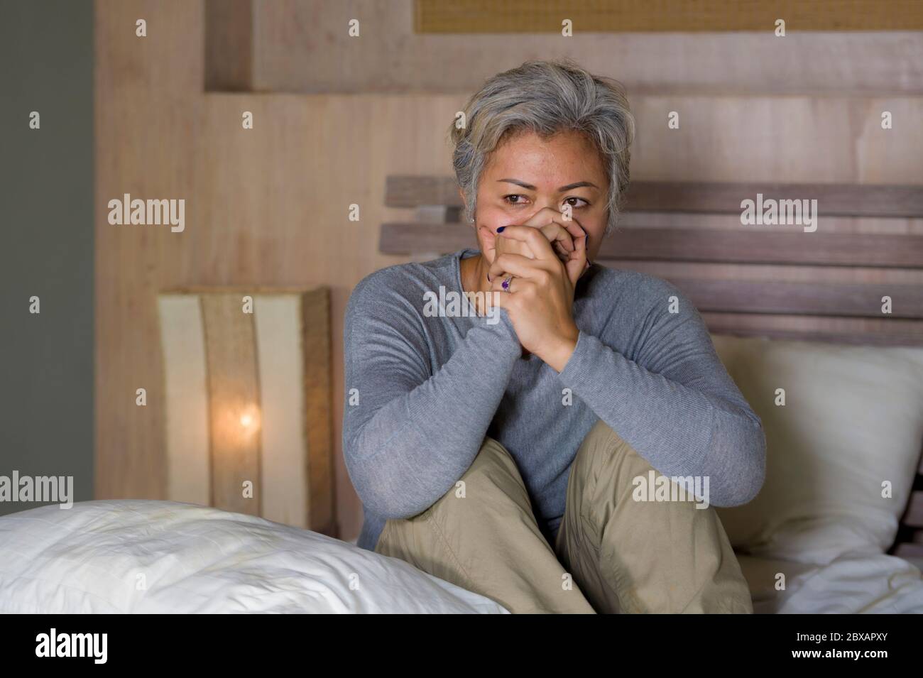 Asian woman crying in bed hi-res stock photography and images - Alamy