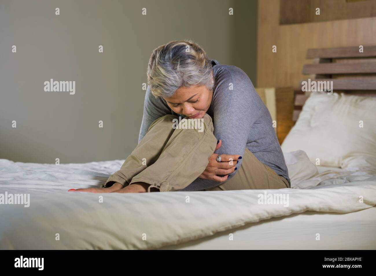 Asian woman crying in bed hi-res stock photography and images - Alamy