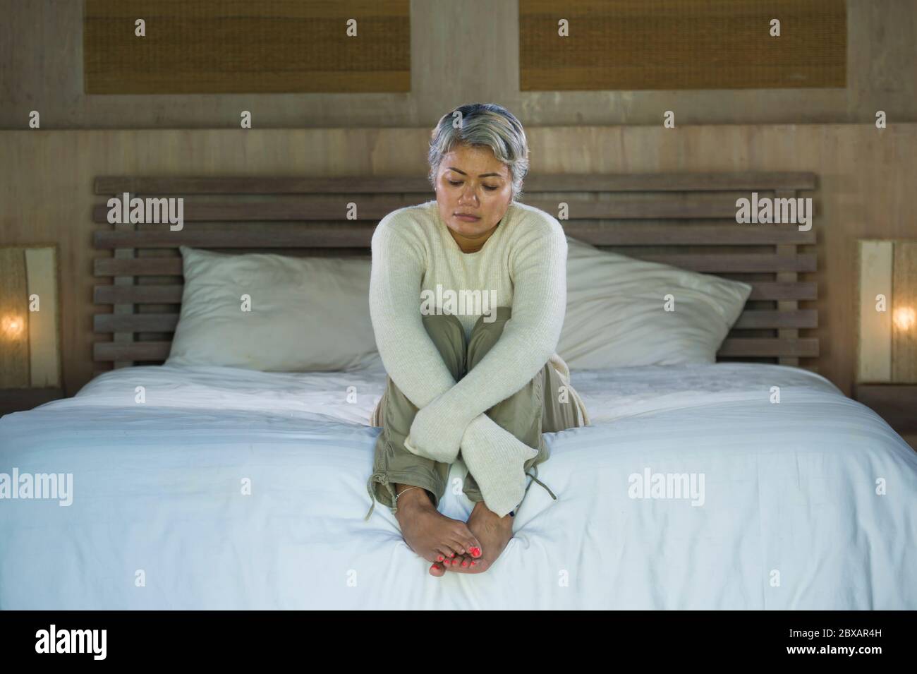 Asian woman crying in bed hi-res stock photography and images - Alamy