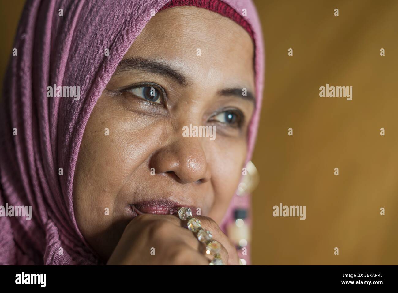 isolated studio portrait of happy and positive senior muslim woman in ...