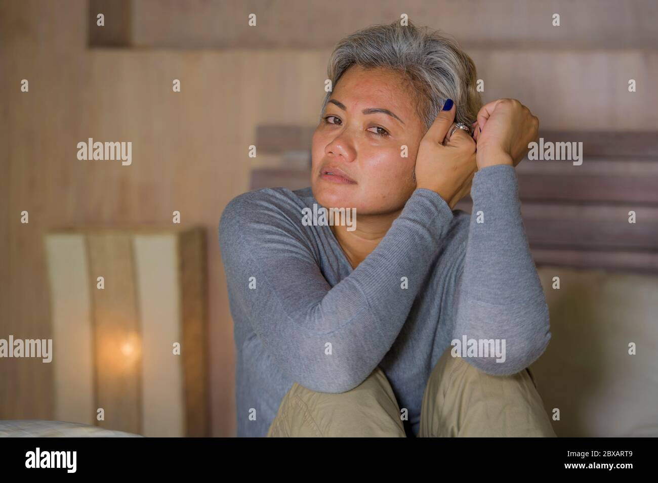 Middle aged woman crying bed hi-res stock photography and images - Alamy